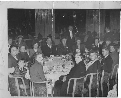 the-group-the-photo.jpg - (Start?)ing from the girl with the two pompoms in hat
and looking to the right - (S)adie Sundstrom, daughter
of Annie (our mother’s sister). Sadie and her kept the
Grand Hotel, Golburn, N.S.W. -
(Mrs) Hogdins (Hogdson?), Sadie's sister, Auckland,
N.Z - (O’C?)onnell, and his mother Madge next to him
-Lavin, Auckland, N.Z [unsure who this person is] -
With flower spray, my daughter Yvonne, Me [Winifred St
Leger formerly O'Halloran nee Walsh} - next to me Mag
[Margaret Newport], Dick [Margaret's husband, Richard
Newport] - (?) ds (?)-  in striped hat, Peggy, Mary’s
daughter - (?) her boy - (No?) hat Bettina Welch. She
has a prominent part in the (pla?)y “Edward, my Son” -
This caption taken from the back of the Photo, which
was damaged, so we guessed the bits missing and these
are included it in the ()